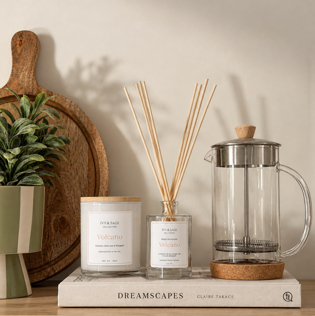 Ivy & Sage glass candle and reed diffuser styled together in a neutral home interior.
