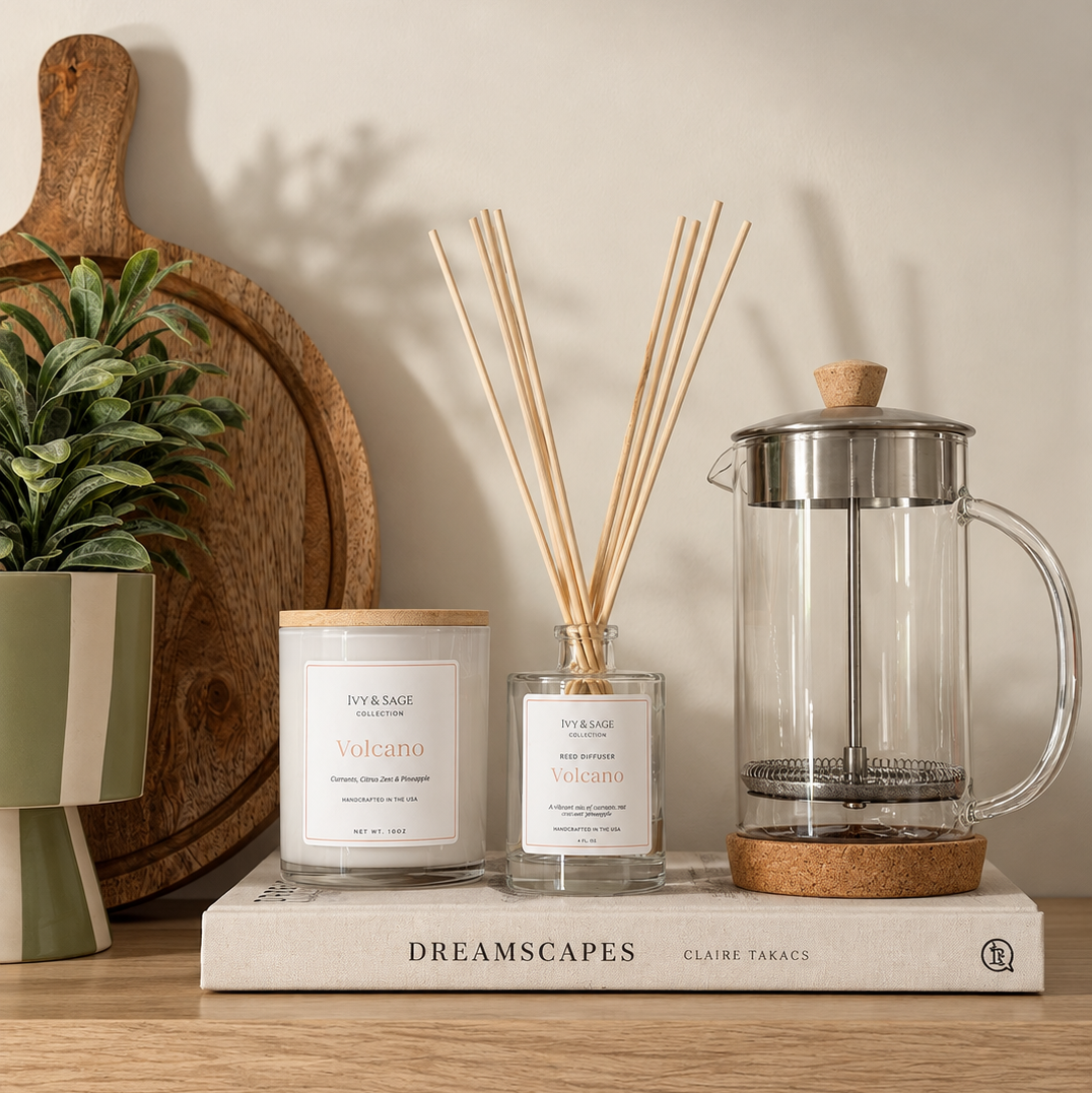 Ivy & Sage Santal 13 glass candle and reed diffuser styled together in a neutral home interior.