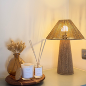 Ivy & Sage  reed diffuser styled in a warm, cosy home interior alongside coordinating home fragrance products.