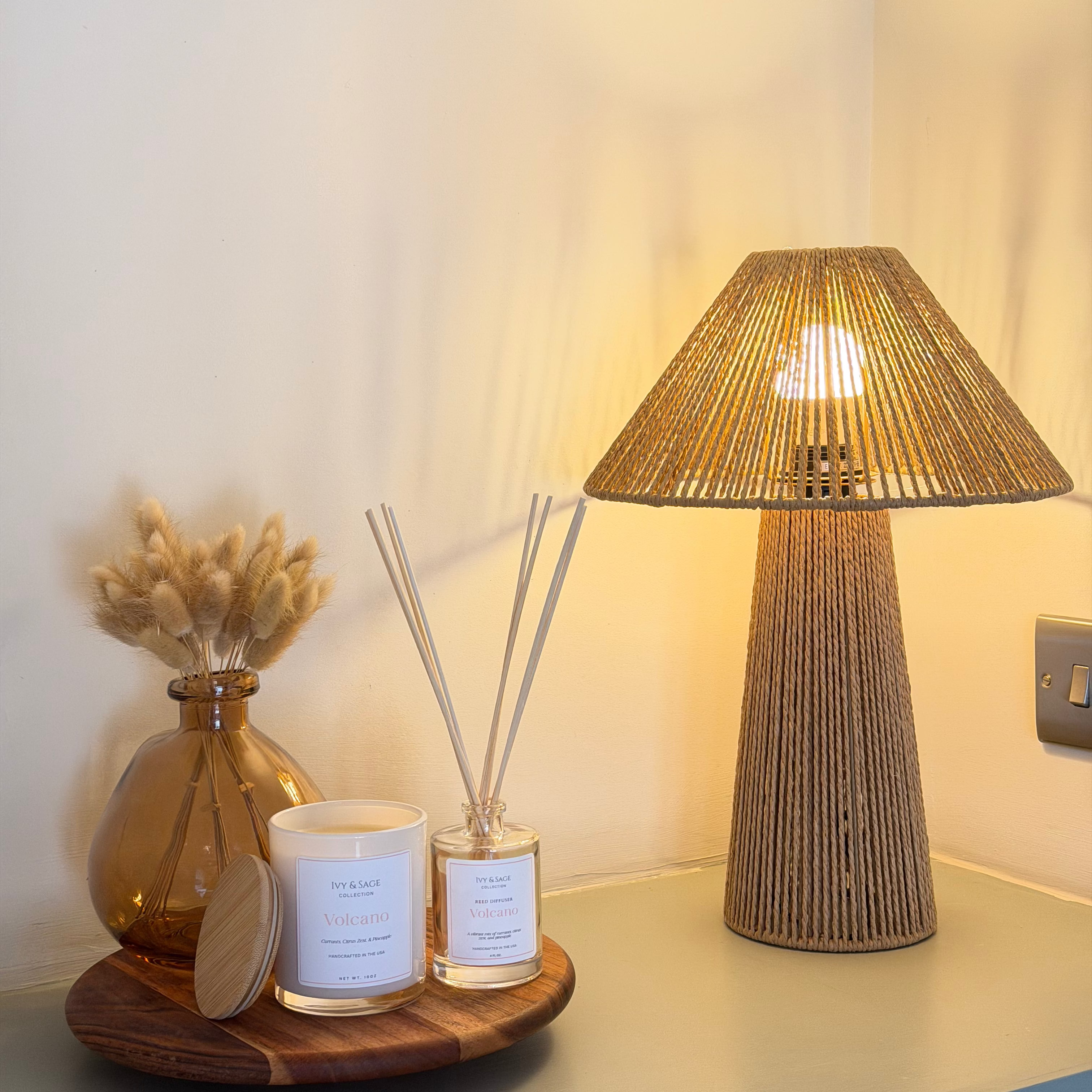 Ivy & Sage  reed diffuser styled in a warm, cosy home interior alongside coordinating home fragrance products.