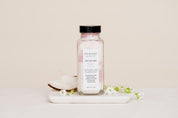 Salt Soak with coconut on white marble slab