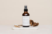 Room & Linen Spray on a beige background in scent Santal 13
