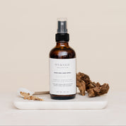 Room & Linen Spray on a beige background in scent Santal 13