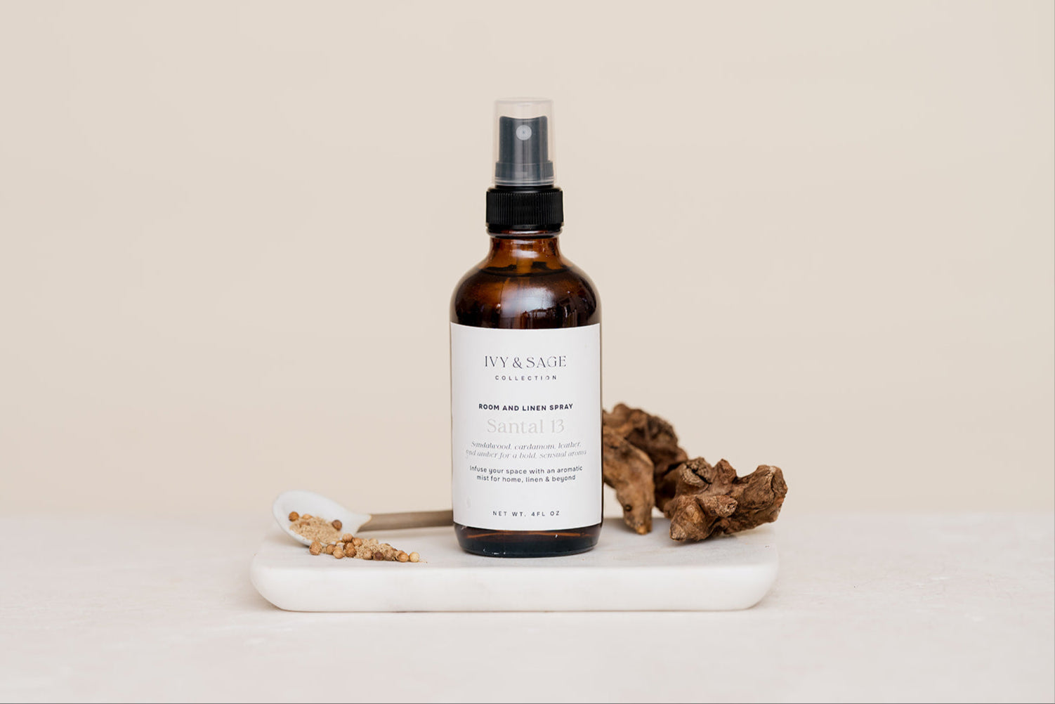 Room & Linen Spray on a beige background in scent Santal 13