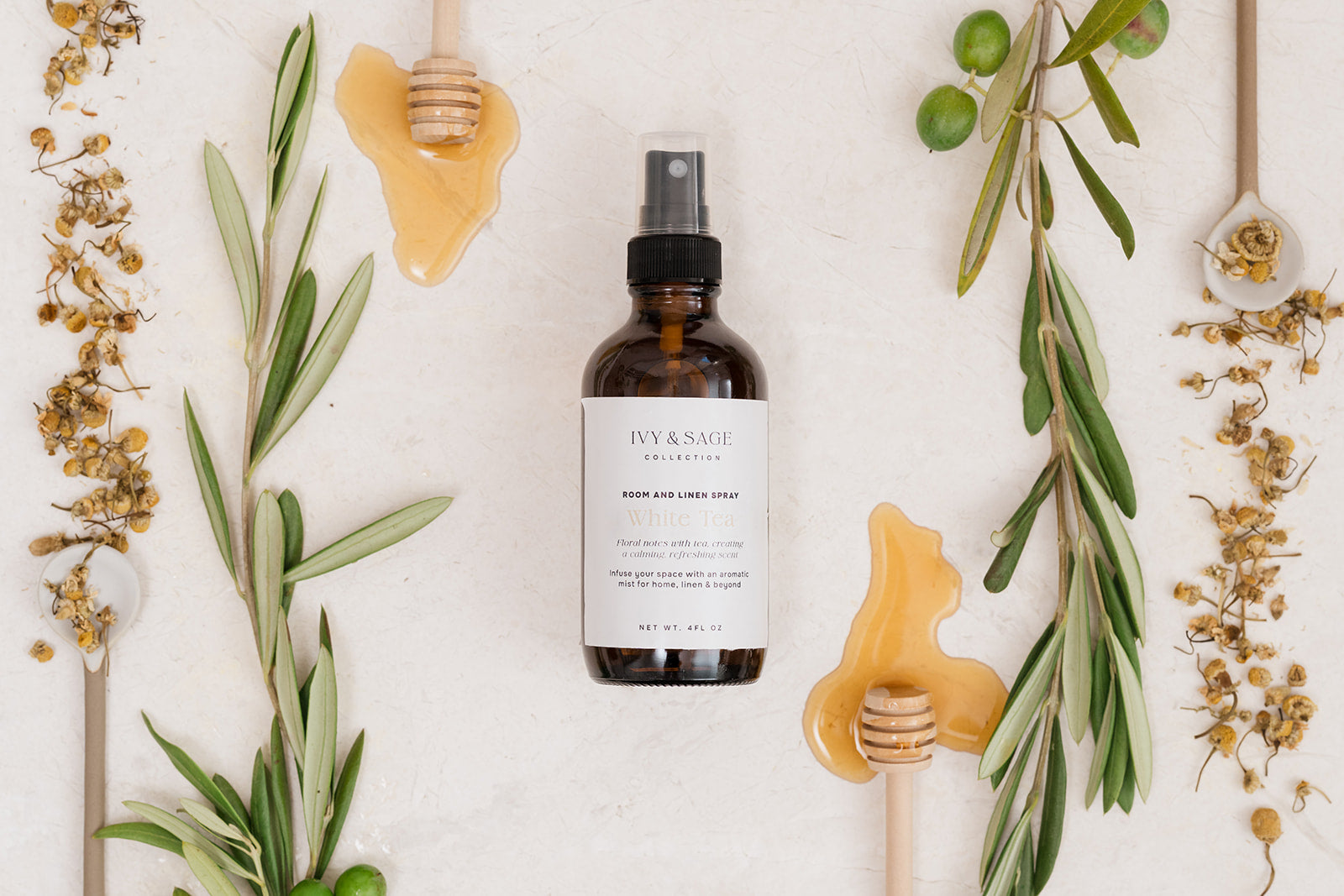 Room & Linen Spray with honey and white tea on beige background