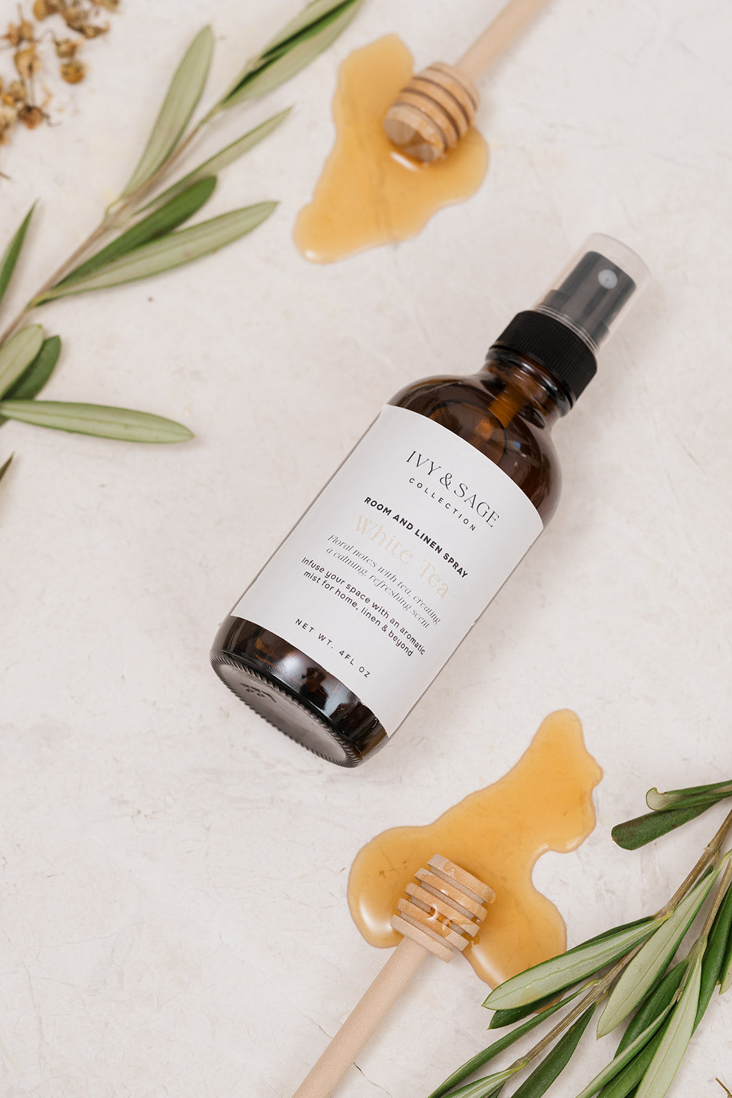 Room & Linen Spray with honey on background