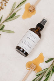 Room & Linen Spray with honey on background