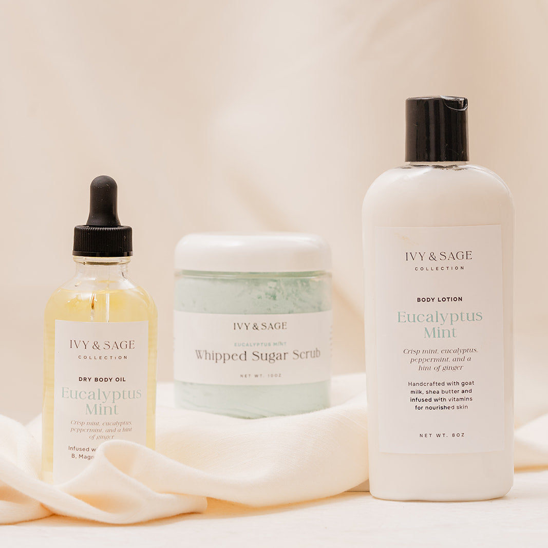 IVY & SAGE Body Oil, Sugar Scrub and Lotion on a soft beige background