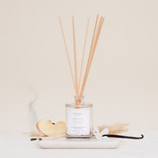 Ivy & Sage Smoked Vanilla reed diffuser with natural reeds, styled with vanilla, apple and warm botanical details on a neutral background.”