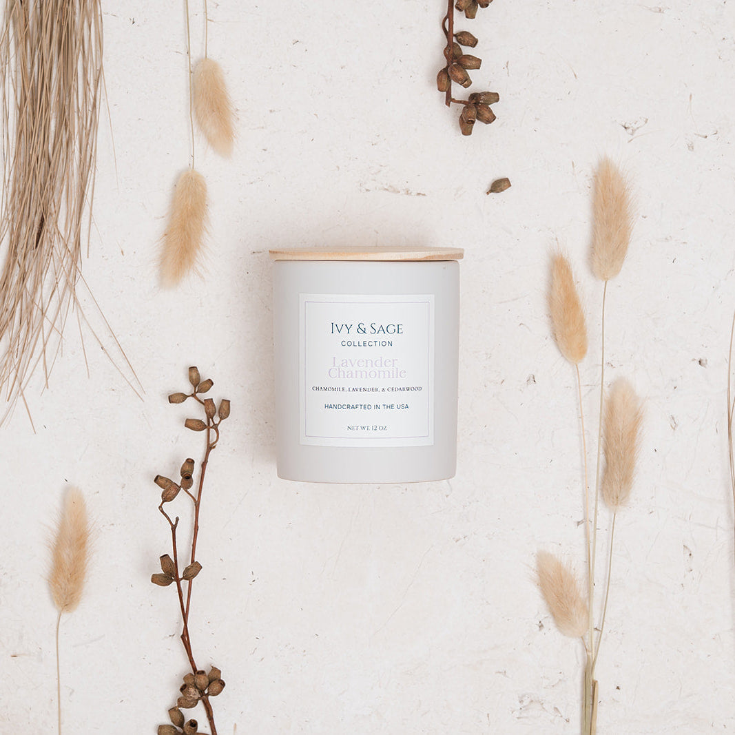Ivy & Sage Lavender & Chamomile ceramic candle styled in a neutral botanical flat lay.