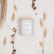 Ivy & Sage Maldives ceramic candle flat lay styled with neutral botanicals and natural textures.